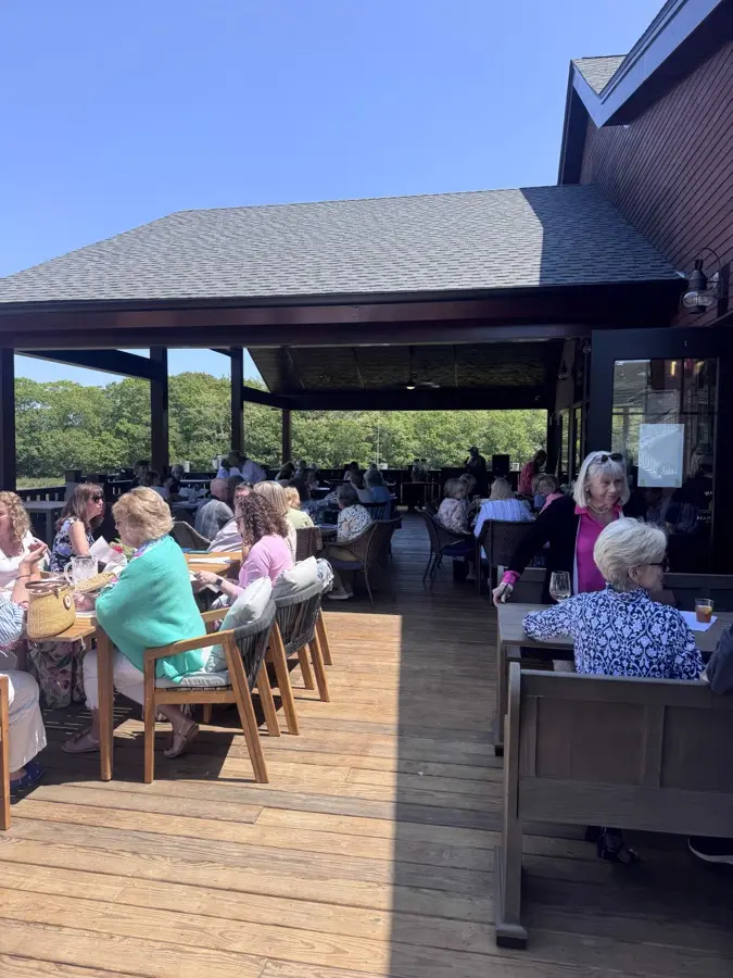 Upper deck open-air seating with waterfront views